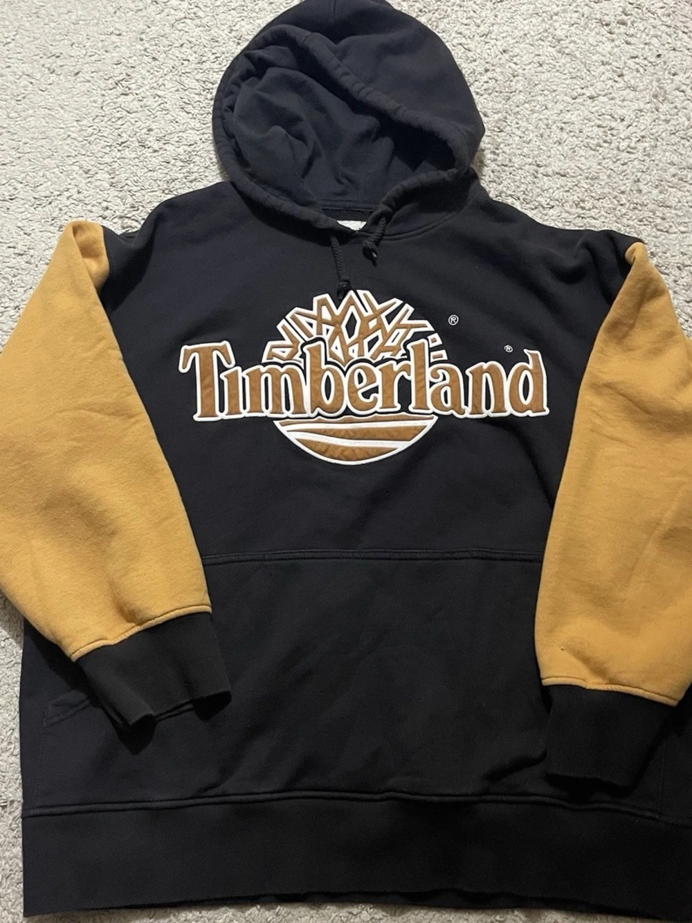 Timberland Black Hoodie with Mustard Contrast Sleeves and Logo